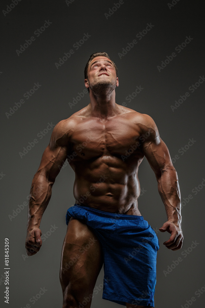Fototapeta premium Muscular guy posing in studio
