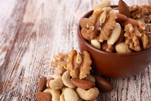 Mix nuts on wooden background