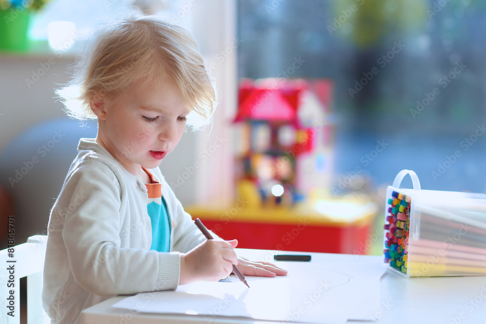 Cute preschooler girl drawing or painting indoors Cute preschooler girl drawing or painting indoors