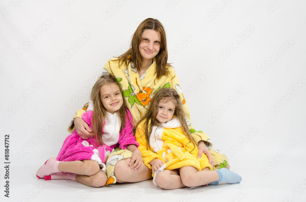 Mom with two daughters in bath robes Mom with two daughters in bath robes
