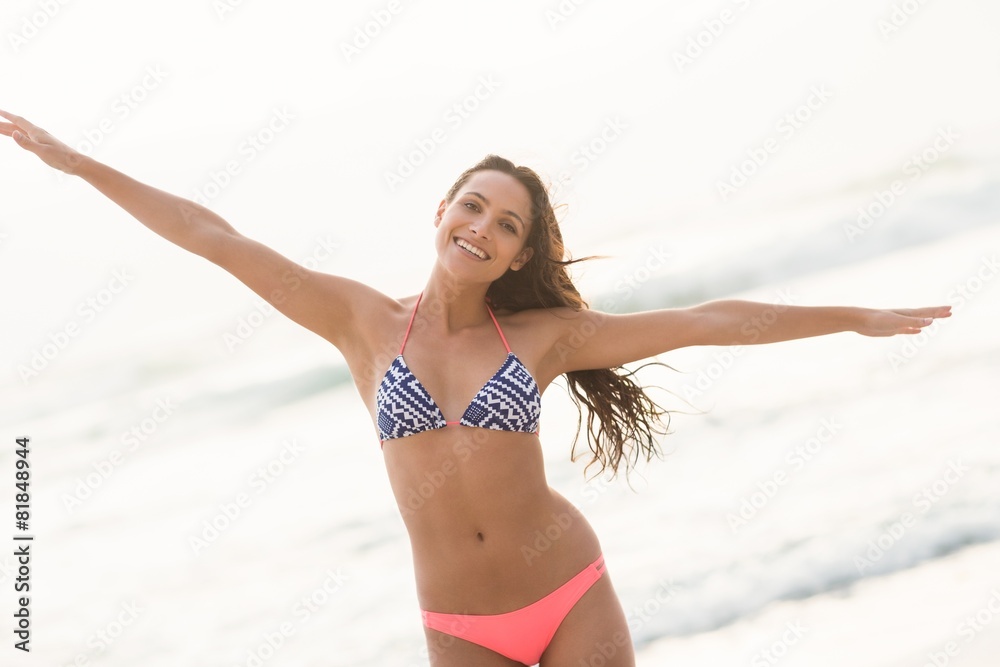 Smiling pretty brunette posing in bikini Smiling pretty brunette posing in bikini