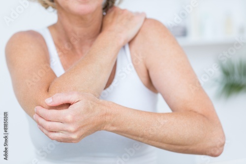 Woman having elbow pain photo