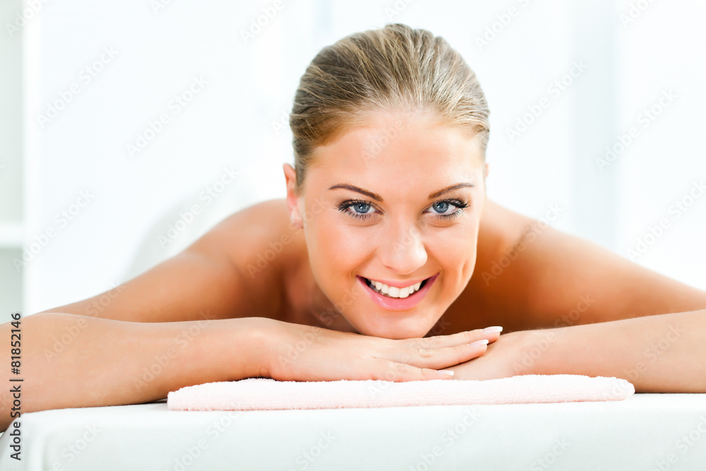 Young woman relaxing after massage on spa treatment Young woman relaxing after massage on spa treatment