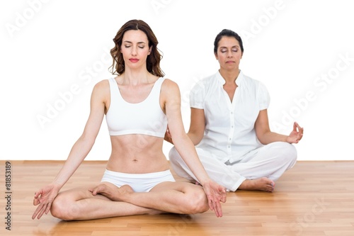 Women sitting in lotus pose