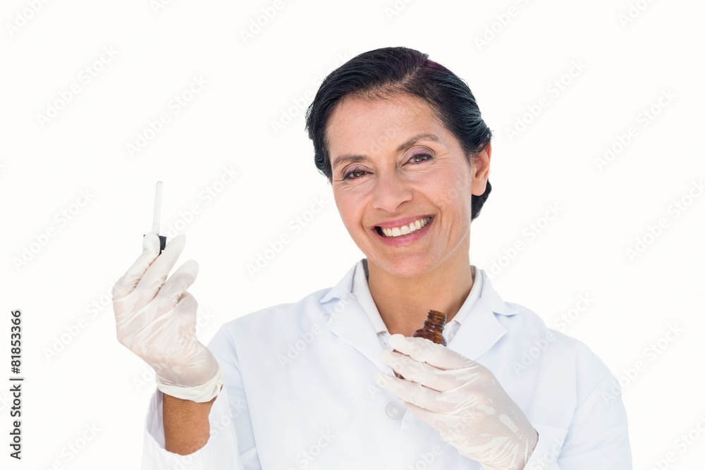 Confident female doctor holding medicine bottle Confident female doctor holding medicine bottle