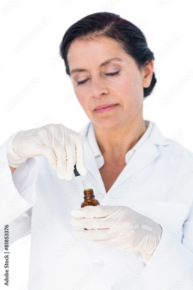 Confident female doctor holding medicine bottle Confident female doctor holding medicine bottle