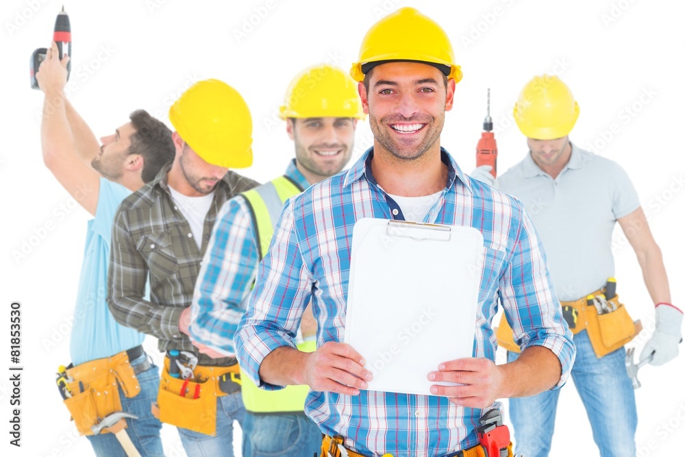 Portrait of smiling manual worker holding clipboard Portrait of smiling manual worker holding clipboard