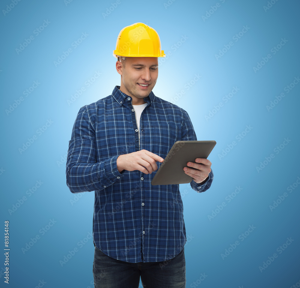 smiling male builder in helmet with tablet pc smiling male builder in helmet with tablet pc