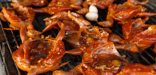 Grilled small asian birds in spicy marinade