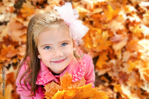 Autumn portrait of adorable little girl