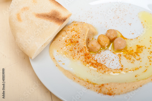 Hummus with pita bread photo