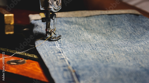 Sewing and jeans, Process color, Selective focus.