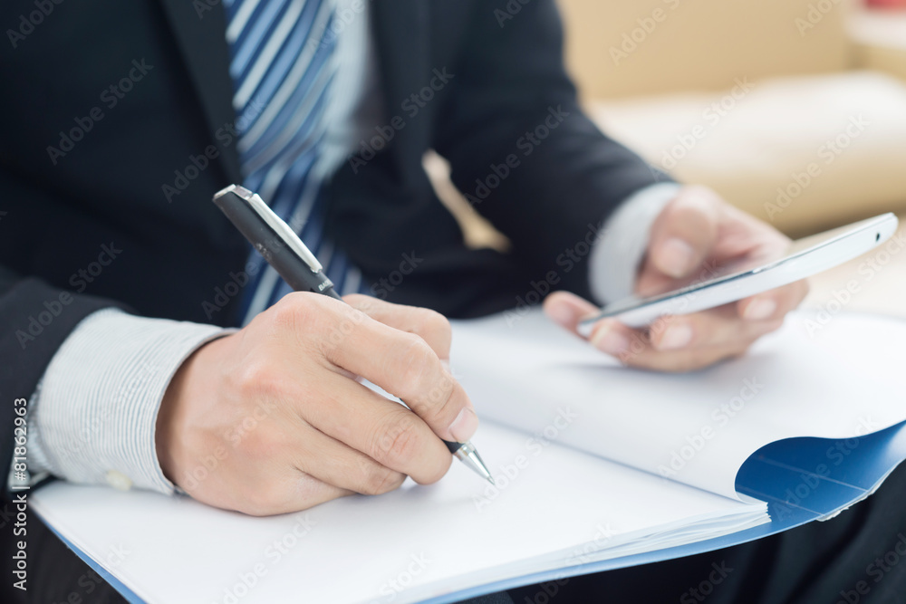 Image of businessman's hands laying on table with pen Image of businessman's hands laying on table with pen
