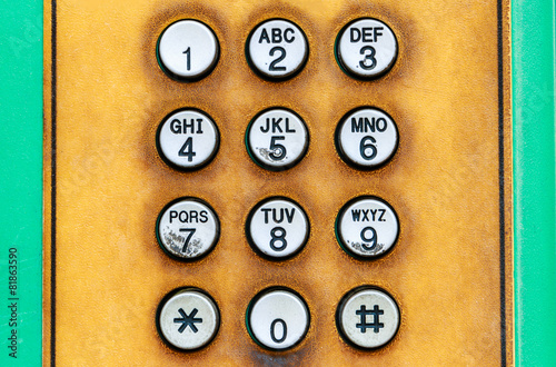 Numeric keypad of public telephone.