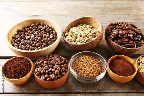 Various of coffee in small dishes on wooden background