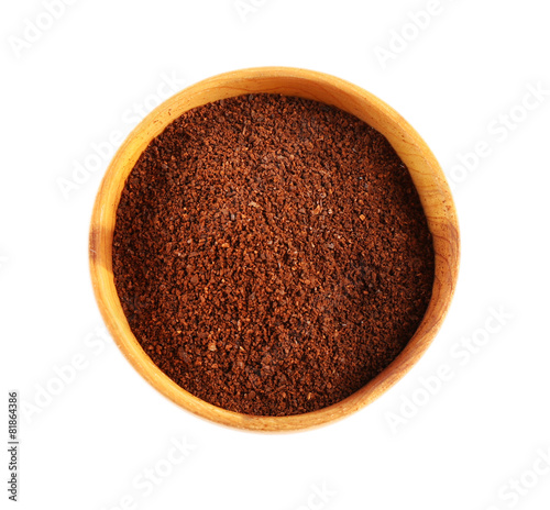 Ground coffee in small dish isolated on white