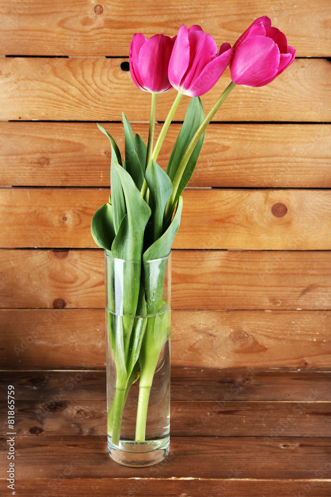 Beautiful tulips on wooden background Beautiful tulips on wooden background