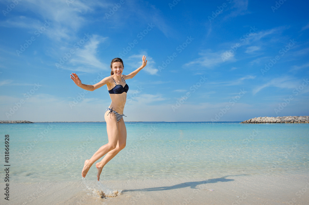 bright picture of happy jumping woman on the beach bright picture of happy jumping woman on the beach
