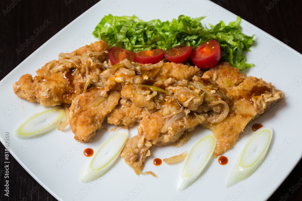 Pork steaks served with vegetables. Pork steaks served with vegetables.
