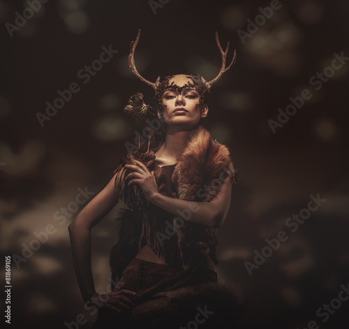 Bilde på lerret Woman shaman in ritual garment with hawk