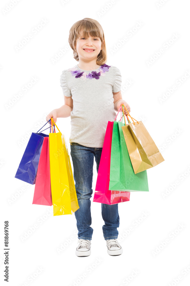 Young blonde girl holding shopping bags