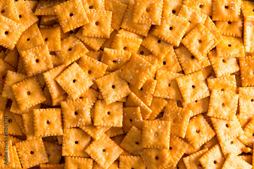 Background texture of square cheese crackers