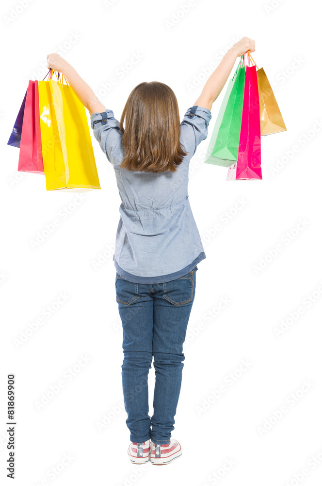 Young shopping girl from behind standing