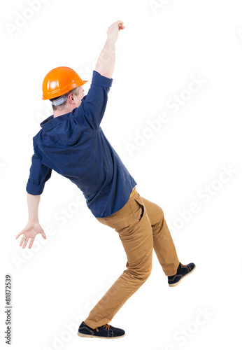 Balancing young man. or dodge falling man/ worker in constructi