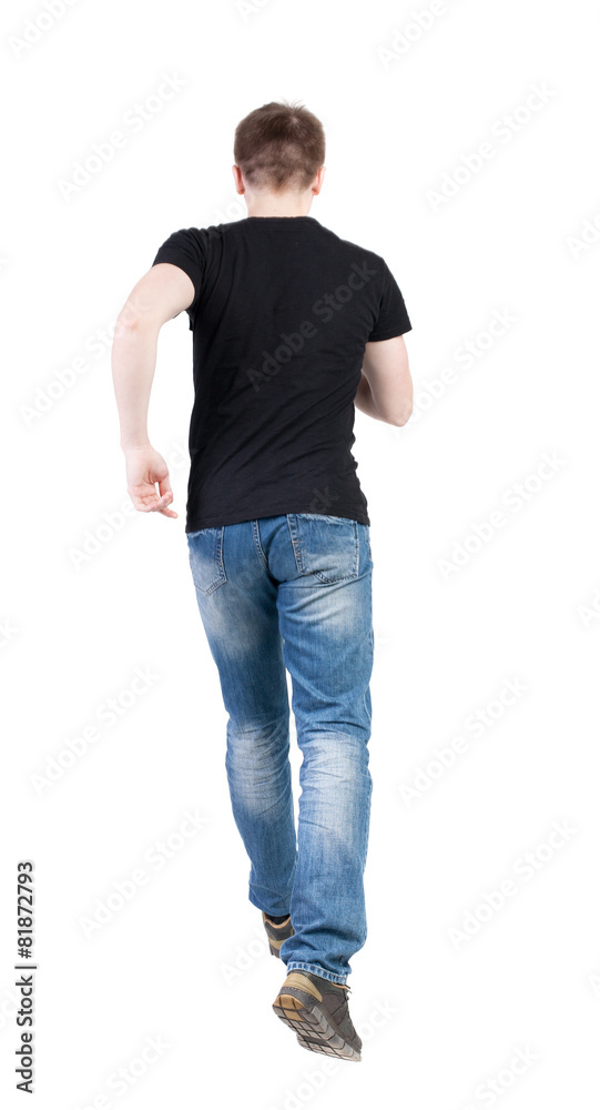 Back view of running man. Walking guy in motion. Back view of running man. Walking guy in motion.