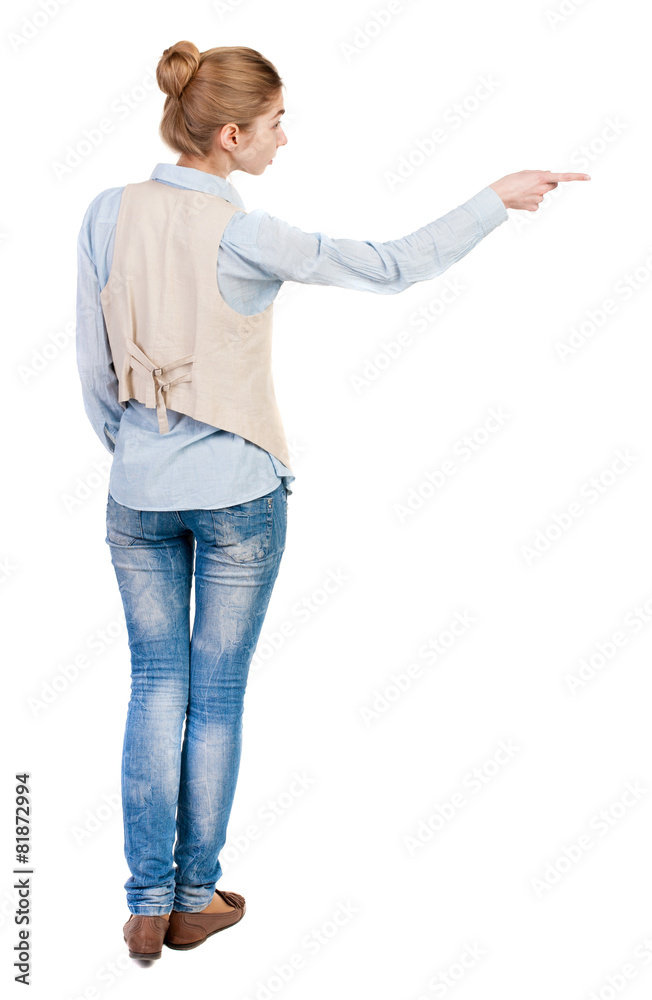 Back view of pointing woman. Back view of pointing woman.