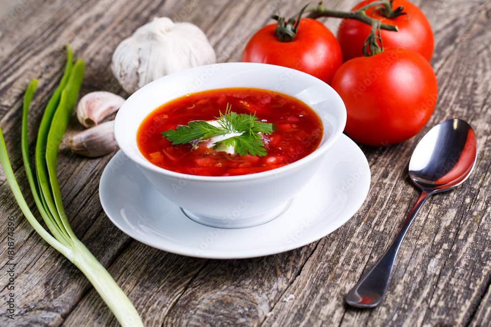 Borsch with bread on a wooden background. Borsch with bread on a wooden background.