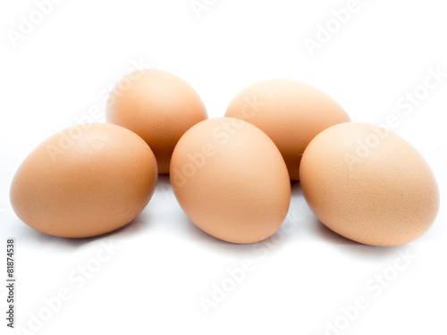Five eggs on white background