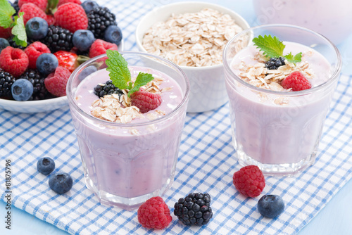 healthy berry smoothies with oatmeal in a glass, top view