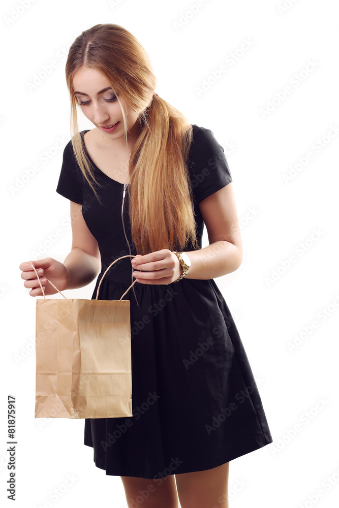 Fashion Shopping Girl Portrait. looking into the bag thrilled Be Fashion Shopping Girl Portrait. looking into the bag thrilled Be