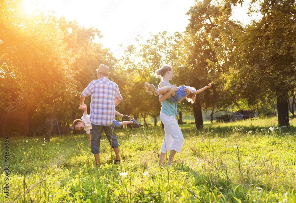 Fototapeta premium Happy young family spending time together outside in nature