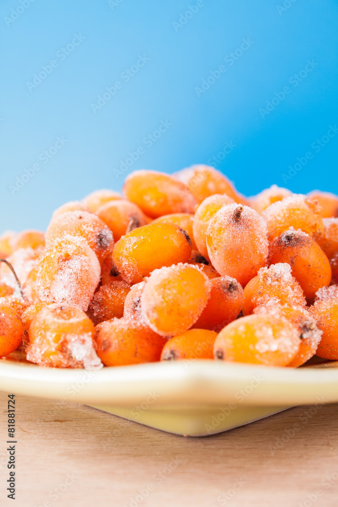 Hippophae rhamnoides on wooden table Hippophae rhamnoides on wooden table