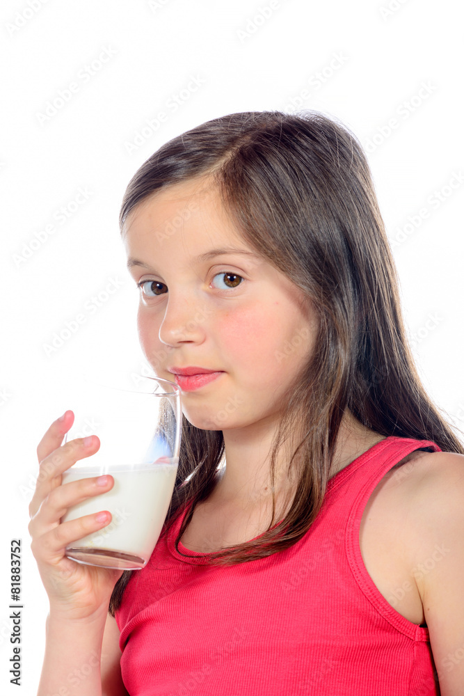 a little girl is drinking a glass of milk a little girl is drinking a glass of milk