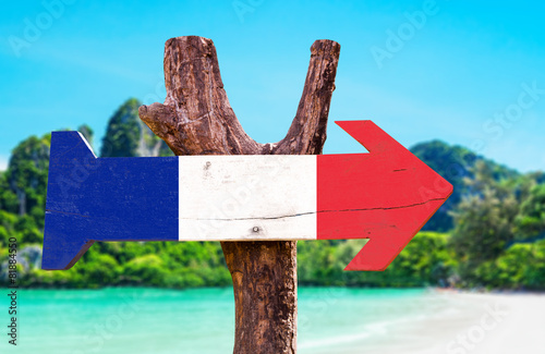 France Flag wooden sign with beach background