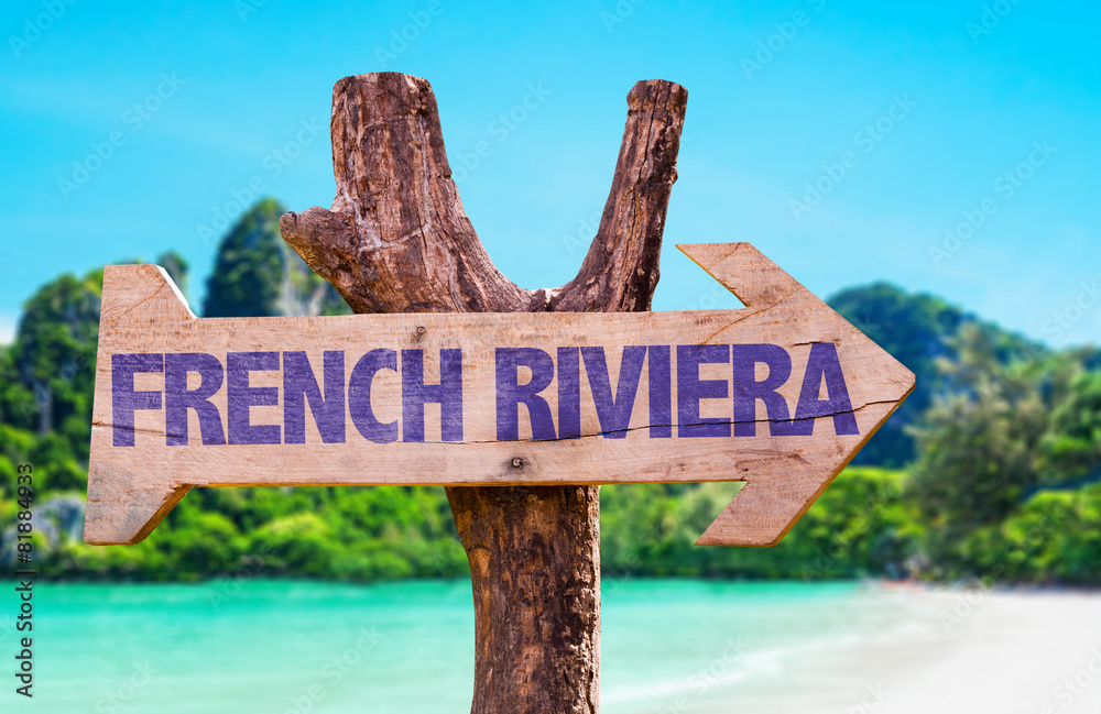 French Riviera wooden sign with beach background