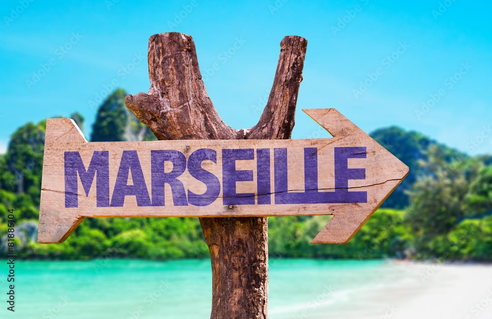 Marseille wooden sign with beach background