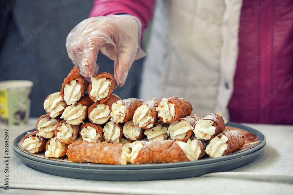 Cannoli pile on the tray