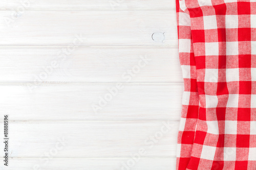 Red towel over wooden kitchen table