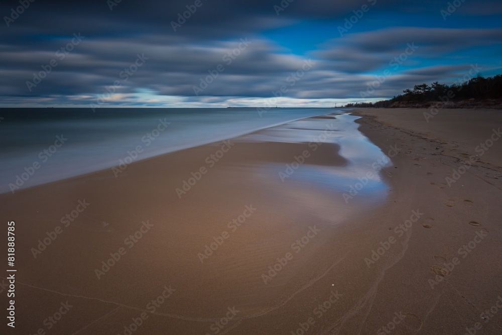 Dark Baltic shore landscape. Long exposure photo.