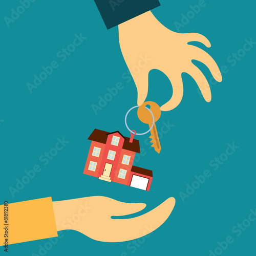 hand real estate agent holding transmits a key with a tag in the
