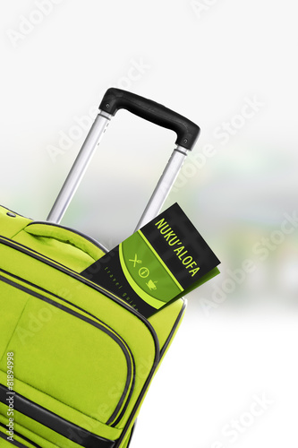 Nuku alofa. Green suitcase with guidebook. photo