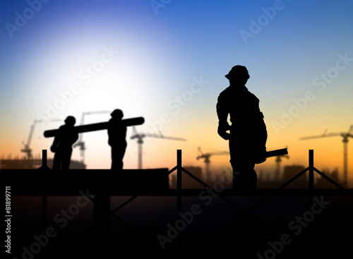 silhouette engineer looking a building site over Blurred constr