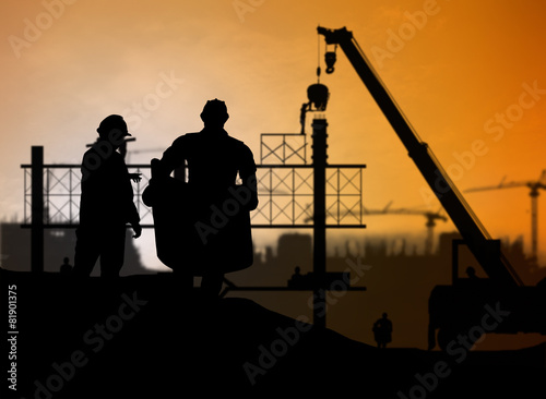 silhouette engineer looking construction worker in a building si