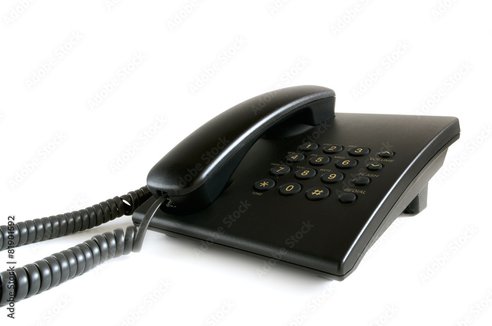 Black stationary phone on a white background. Black stationary phone on a white background.