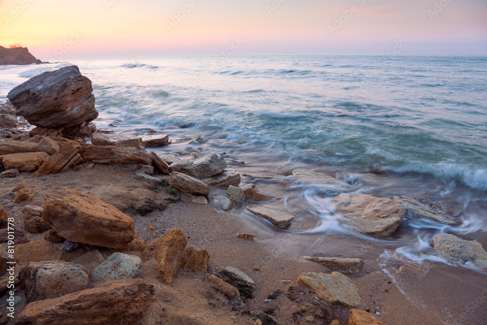 sunrise landscape,  the rocky sea coast and water waves