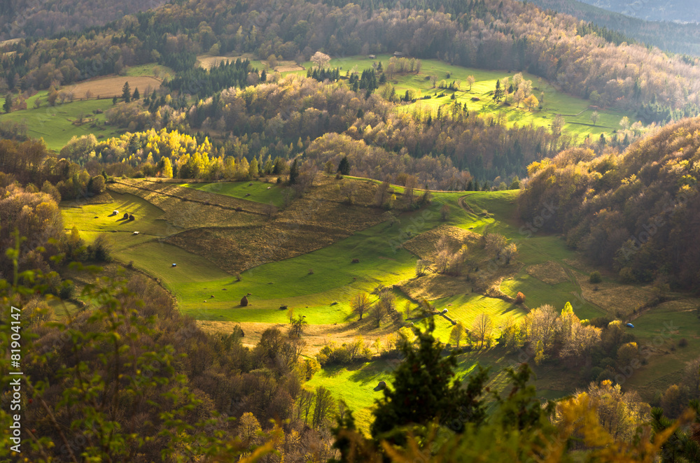 Mountain meadows at autumn illuminated by devine light